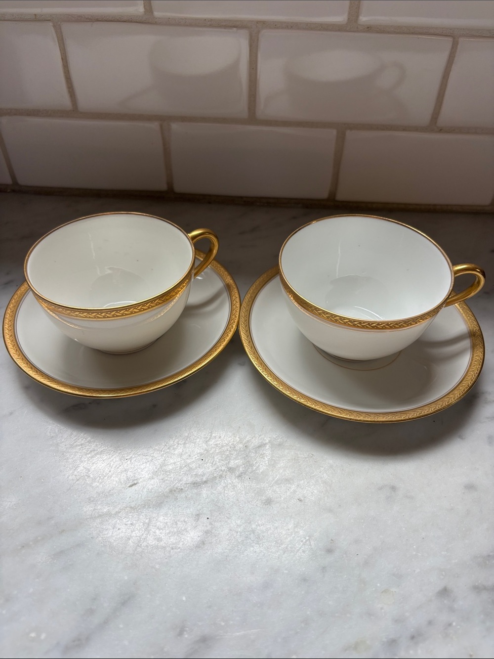 Vintage (1910) Limoges pair of gold rimmed tea cups & saucers